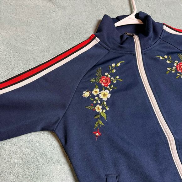 Navy blue floral zip up track jacket with red and white striped sleeves - Picture 5 of 8